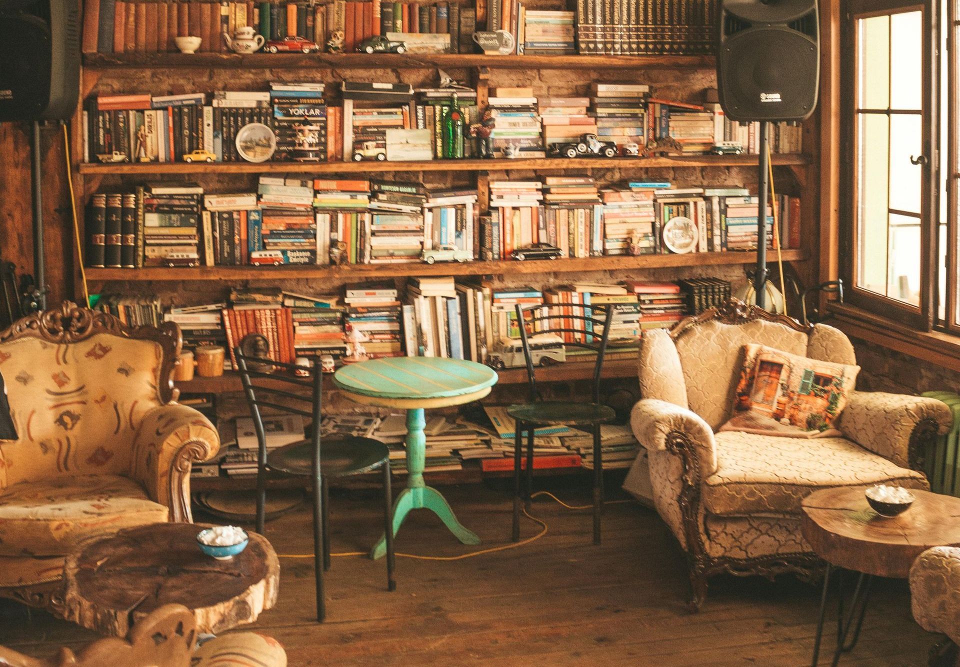 Cozy library room with armchairs and bookshelves